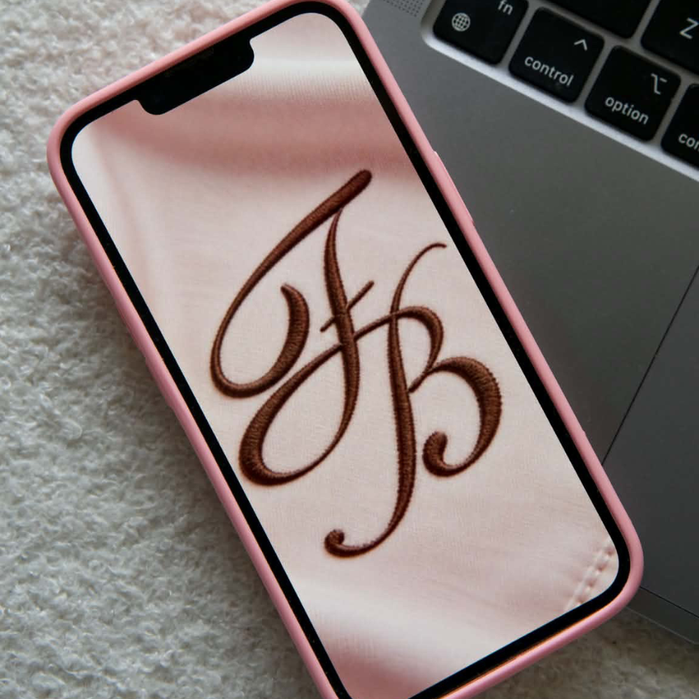 The Freiya Beauty monogram on a phone case
