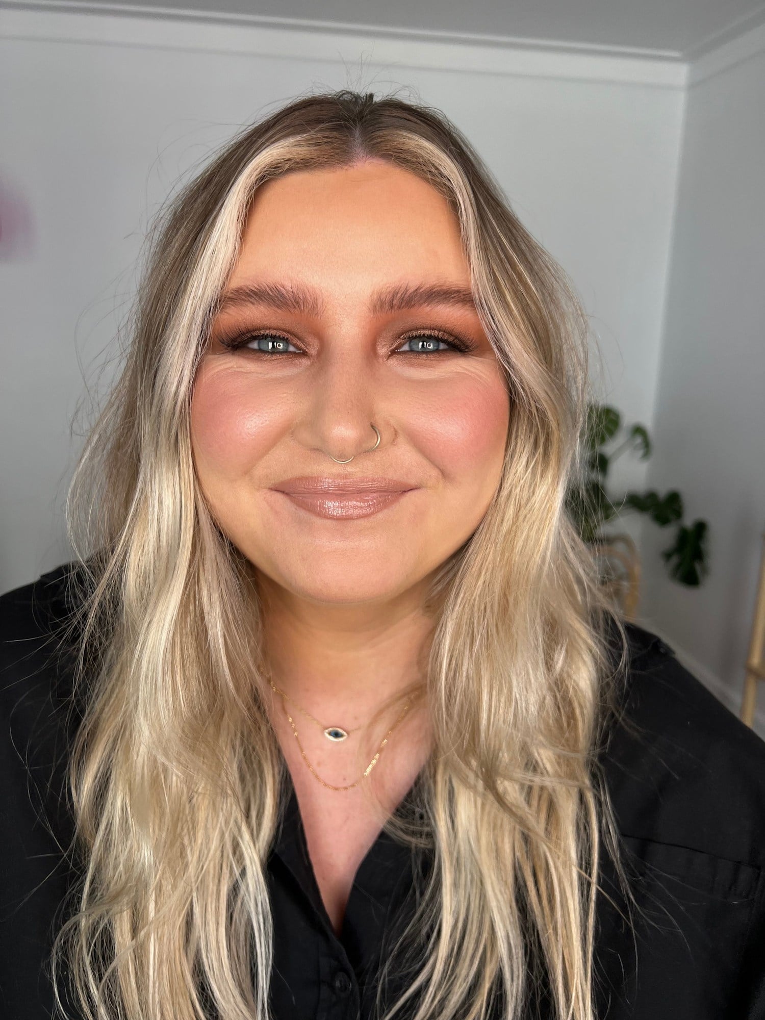 Client with bold graphic makeup, styled for a night out