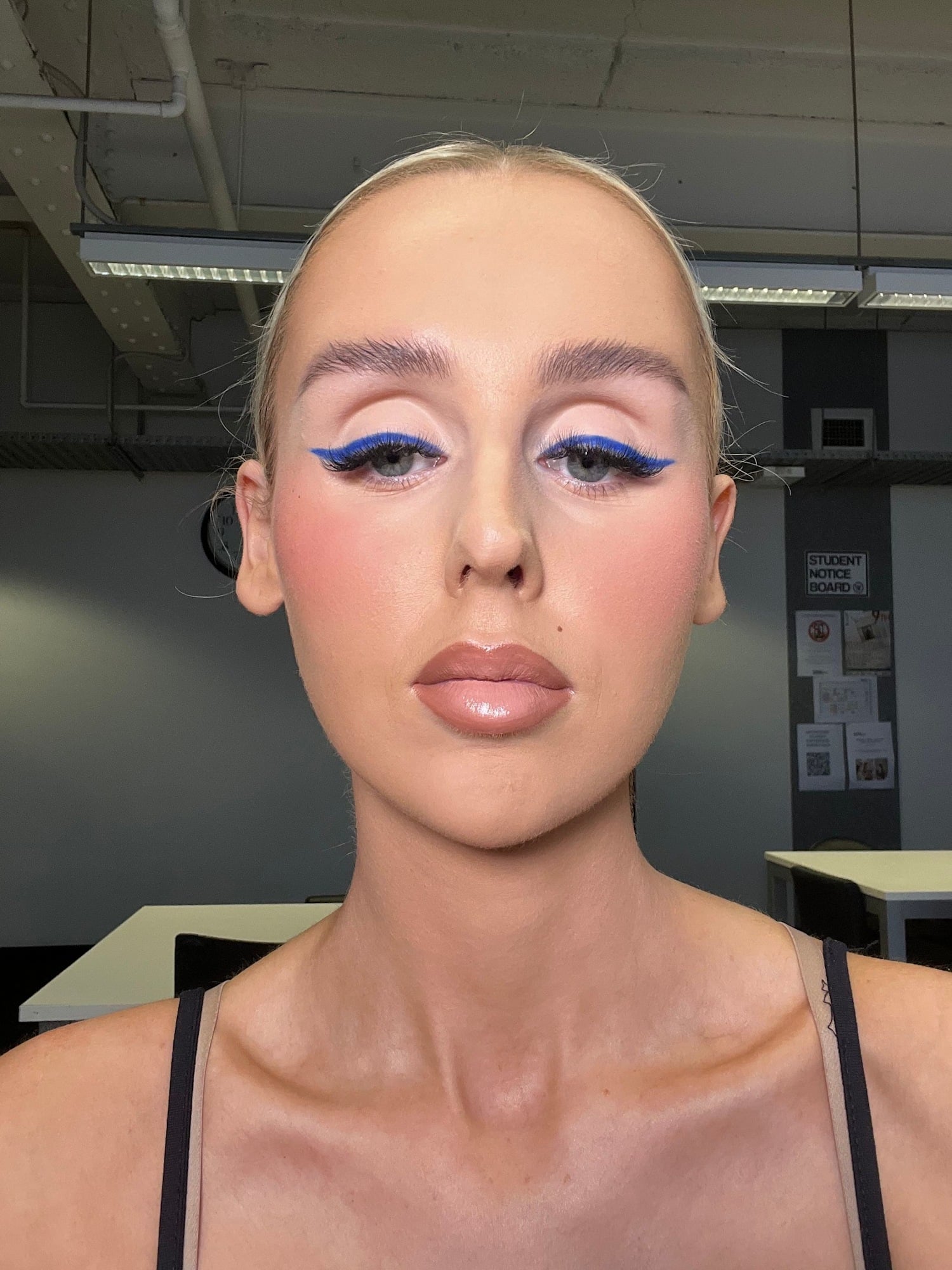 Cobalt blue graphic liner with a bleached brow