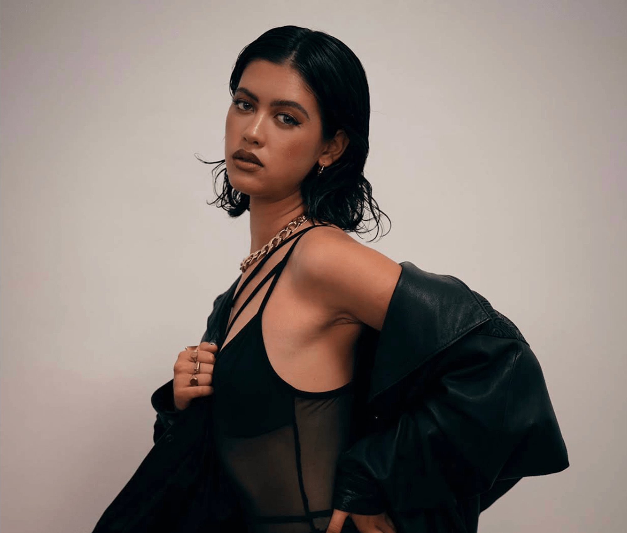 Sculpted editorial makeup with a deep brown lip